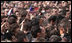 American flags are waved by some in the crowd at Zagreb's St. Mark's Square as President George W. Bush addresses the thousands who turned out to welcome him Saturday April 5, 2008.