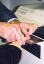 Employment applicant being fingerprinted.
