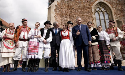 President George W. Bush and Prime Minister Ivo Sanader appear on stage with dancers in tradition Croatian garb Saturday, April 5, 2008, in Zagreb's St. Mark's Square. The President and Mrs. Bush made the overnight stop in the Croatian capitol before departing for Russia.