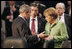 President George W. Bush joins Danish Prime Minister Anders Fogh Ransmussen and German Chancellor Angela Merkel Thursday, April 3, 2008, prior to the start of the afternoon's NATO Summit Meeting on Afghanistan in Bucharest.