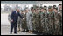 President George W. Bush reaches out to U.S. military personnel Wednesday, April 2, 2008, as he arrived at Mihail Kogaliceanu Airport in Constanta, Romania, for his return flight to Bucharest after meeting with President Traian Basescu at his presidential retreat in Neptun.