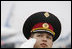 A member of the honor guard salutes as President George W. Bush and Mrs. Laura Bush prepare to depart Kyiv's Boryspil State International Airport Tuesday, April 1, 2008, after spending a daylong visit in Ukraine before continuing on to Bucharest, site of the 2008 NATO Summit.