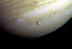 Jupiter - Io In Front of Jupiter's Turbulent Clouds