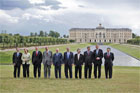 The G8 leaders pose for a photograph at Konstantinvosky Palace in Strelna, Russia, Sunday, July 16, 2006. From left, they are: Italian Prime Minister Romano Prodi; German Chancellor Angela Merkel; British Prime Minister Tony Blair; French President Jacques Chirac; Russian President Vladimir Putin; President George W. Bush; Japanese Prime Minister Junichiro Koizumi; Canadian Prime Minister Stephen Harper; Finnish Prime Minister Matti Vanhanen; and European Commission President Jose Manuel Barroso. White House photo by Paul Morse 