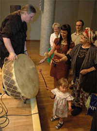 An inspired child bangs the drum following the Fox Trio concert during their stay in Belarus July 10-13, 2008.  [Yuri Dudinski, U.S. Embassy Minsk]