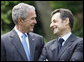 President George W. Bush and French President Nicolas Sarkozy spend a few moments together talking during a sculpture unveiling Saturday, June 14, 2008 at the U.S. Ambassador's residence in Paris. White House photo by Eric Draper