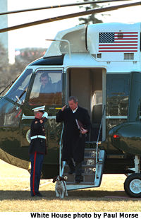 Photo of President Bush saluting marine. White House Photo by Paul Morse