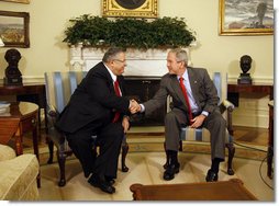 President George W. Bush shakes hands with Jalal Talabani, President of Iraq, during a meeting Wednesday, June 25, 2008, in the Oval Office at the White House. President Bush said, "It's been my honor to welcome a friend, President Talabani, back to the Oval Office. He is the President of a free Iraq. He is a man who's been on the front lines of helping to unify Iraq and to help Iraq recover from a brutal regime -- that of Saddam Hussein."  White House photo by Eric Draper