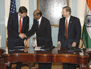 Under Secretary of State Marc Grossman, Indian Foreign Secretary Shyam Saran, and Under Secretary of Commerce Kenneth Juster. 
