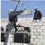 Workers constructing a block masonry wall