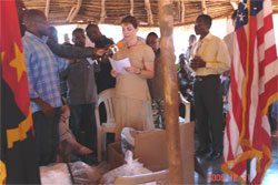 DAS Carol Thompson addresses victims of the recent floods in Viana, Luanda, Angola.  Some local media was in attendance.