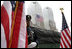 A police officer stands at attention at Ground Zero during the ceremonies marking the fifth anniversary of the September 11th terrorist attacks in New York City Sunday, September 10, 2006.