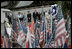 During their visit to Ground Zero, President George W. Bush and Laura Bush look at a memorial created from some of the objects visitors have brought to the site in New York City Sunday, September 10, 2006.