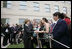 After placing a memorial wreath at the Pentagon, the President and Laura Bush greet audience members Monday, Sept. 11, 2006, during ceremonies marking the fifth anniversary of the September 11th attacks.