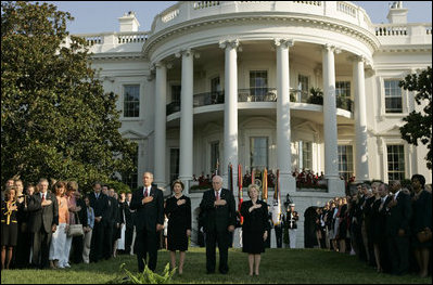 President Bush stands with Laura Bush, Vice President Dick Cheney and Mrs. Cheney as they observe a moment of silence, on the South Lawn, in honor of 9/11 victims September 11, 2005. This marks the fourth anniversary of terrorist attacks on both the World Trade Center and The Pentagon.