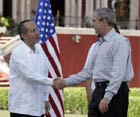 President Bush exchanges handshakes with Felipe Calderon, President of Mexico, during the arrival ceremonies March 13, 2007, welcoming the President and Mrs. Bush. White House photo by Paul Morse