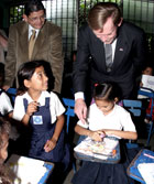 Deputy Secretary Zoellick talks to children from the United Nations elementary school about their class work during his recent visit to Nicaragua.