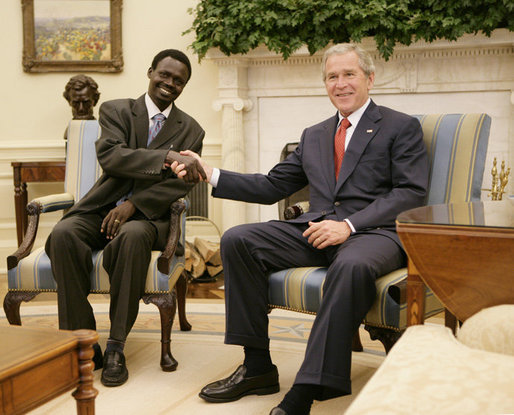 President George W. Bush welcomes Sudanese Liberation Movement leader Minni Minnawi to the Oval Office Tuesday, July 25, 2006 [White House Photo].