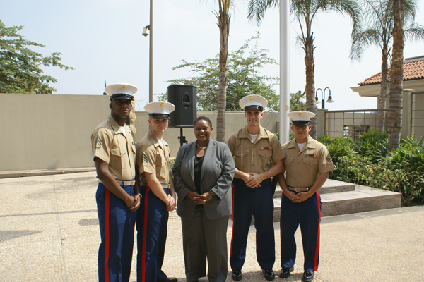 Assistant Secretary Frazer With the U.S. Marine Security Guard Detachment in front of the U.S. Embassy in Luanda.