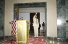 Secretary Rice waves as she approaches the podium at the U.S. Embassy Baghdad during her surprise visit to Iraq. State Department photo. 