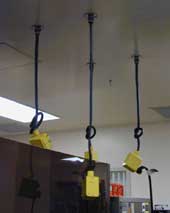 Keeping cords above ground in wet environments reduces the chance of electrical shock and reduces wear and tear on cords
