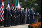 President George W. Bush delivers remarks after meeting with G7 finance ministers and heads of international finance institutions, Saturday morning, Oct. 11, 2008, in the Rose Garden at the White House. Pictured with President Bush from left to right are, Chairman of the Financial Stability Forum Mario Draghi, IMF Managing Director Dominique Strauss-Kahn, Eurogroup Chairman and Prime Minister of Luxembourg Jean-Claude Juncker, Japan's Finance Minister Soichi Nakagawa, Secretary of State Condoleezza Rice, Treasury Secretary Henry Paulson, France's Finance Minister Christine LeGarde, Canada's Finance Minister Jim Flaherty, Britain's Chancellor of the Exchequer Alister Darling, Italy's Economy Minister Giulio Tremonti, Germany's Finance Minister Peer Steinbruck and World Bank President Robert Zoellick. White House photo by Eric Draper