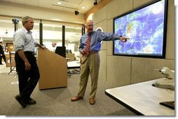 President George W. Bush receives briefing on Hurricane Frances from Max Mayfield, Director of the National Hurricane Center, in Miami, Fla., Wednesday, Sept. 8, 2004.  White House photo by Eric Draper