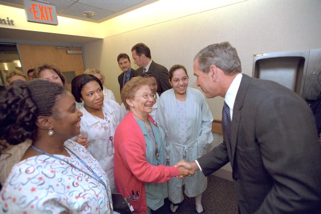A photograph of the President shaking hands with doctors and nurses at Inova Fair Oaks Hospital, Fairfax, Virginia.