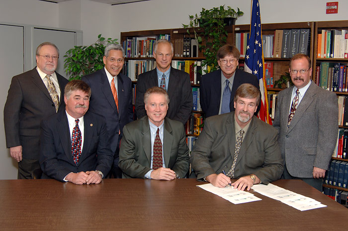 (seated left to right) John N. Dillenburg, ADSC WCC Executive Director; Richard S. Terrill, OSHA Region X Regional Administrator; Michael Kennedy, ADSC WCC President; and (standing left to right) Bob Birdsall, Co-Chairman WCC Safety Committee; W. Walter Lang, USDOL Office of the Secretary; Dale R. Cavanaugh, OSHA Region X Assistant Regional Administrator; Colin Perkins, Co-Chairman WCC Safety Committee and David L. Mahlum, OSHA Region X Assistant Regional Administrator after the Alliance signing ceremony.