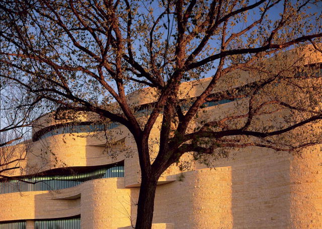 A photograph of the North side of the National Museum of the American Indian on the National Mall. 