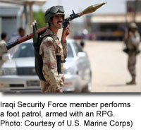 Iraqi Security Force member performs a foot patrol, armed with an RPG. [Photo: Courtesy of a U.S. Marine Corps