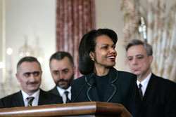 Secretary Rice speaks at the signing of the Millennium Challenge Compact between the United States and the Republic of Armenia at the State Department in Washington, Monday March 27, 2006. Behind her are Armenian Minister of Finance and Economy Vardan Khachatryan, delegation member Artashes Emin, and Armenian Foreign Minister Vartan Oskanian. [© AP/WWP]