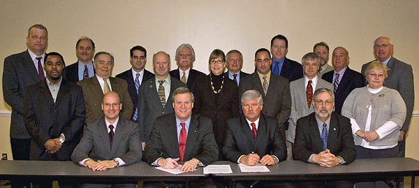 (from left to right) Standing: Michael S. Pankonin, Assistant Director, Technical and Safety Services, AEM; Kevin Cannon, Safety Specialist, NAHB; Scott Schneider, Director for Occupational Safety and Health, Laborers' Health and Safety Fund of North America; Matt Burkhart, Crane Safety Committee, CI-ASCE; Karl Anderson, Safety Engineer, U.S. Army Corps of Engineers; John Masarick, Director of Codes and Safety, IEC; Richard Marshall, Chairman, Safety Committee, ADSC; Nancy McNabb, Director, Government Affairs, NFPA; Thomas Stowell, Vice President, CSDA; Ron Pilla, Chairperson, Safety Committee, SWR Institute; Doug Walker, Vice President, Atlantic Concrete Cutting, Inc., CSDA; John Mroszczyk, Member, ASSE; David Kliwinski, Manager of Safety, Jacobs Engineering Group, Inc., NCSE; Chris Peck, Chairman, NCSE; Andy Peters; Corporate Vice President, Safety, Parsons, NCSE; Ellen Stewart, Senior Safety Engineer, U.S. Army Corps of Engineers; Sitting: Robert Matuga, Director, Labor, Safety & Health Regulatory Affairs, NAHB; Edwin G. Foulke, Jr., OSHA Assistant Secretary; Brad Giles, Vice President, Environmental Safety and Health, Washington Division of URS Corporation; Bill Jackson, Director of Safety, Granite Construction Inc., NCSE; at the Construction Roundtable on January 30, 2008.