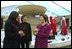 Laura Bush talks with Fern Mallis of 7th on Sixth, left, and Lynn Long, chief of Fashion Week production, after reviewing the designer dresses on display for "The Red Dress Project" in Bryant Park in New York City Friday, Feb. 14, 2003. "The Red Dress Project" is part of the Heart Truth campaign to raise awareness of heart disease as the number one killer of women. The dresses were created by 19 American designers and will tour the country through 2004. White House photo by Susan Sterner.