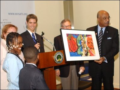 Secretary Paige accepts the gift of a student painting at the SAIL (School for Arts in Learning) Public Charter School in Washington, D.C., where he kicked off Charter Schools Week.