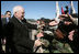 Vice President Dick Cheney shakes the outstretched hands of soldiers Tuesday, Feb. 26, 2008, following a rally for the troops at Fort Hood, Texas, home of the U.S. Army's First Cavalry Division.