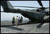  USS John C. Stennis Strike Group Commander Rear Admiral Kevin Quinn greets Vice President Dick Cheney and his daughter Liz Cheney, left, upon their arrival, Friday, May 11, 2007, to the aircraft carrier John C. Stennis in the Persian Gulf. 