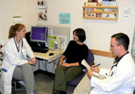 Health care providers talking to a patient