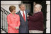 President George W. Bush and Laura Bush receive Miss Beazley, their new Scottish Terrier puppy, from breeder Bill Berry on the South Lawn of the White House Jan. 6, 2005. Miss Beazley is a birthday present from the President to Mrs. Bush. Beginning life at the White House in proper fashion, Miss Beazley's started her first day with a press conference.