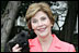 Laura Bush holds Miss Beazley shortly after the arrival of the 10-week-old Scottish terrier to the White House Thursday, Jan. 6, 2005. 