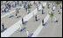 Military personnel stand at attention behind each of the 184 memorial benches draped in ceremonial cloths Thursday, Sept. 11, 2008, during the dedication of the 9/11 Pentagon Memorial at the Pentagon in Arlington, Va.