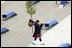 A bagpiper plays as he walks through the 9/11 Pentagon Memorial Thursday, Sept. 11, 2008, during the dedication ceremony of the 9/11 Pentagon Memorial at the Pentagon in Arlington, Va.