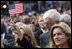 A woman waves an American flag during the dedication ceremony of the 9/11 Pentagon Memorial Thursday, Sept. 11, 2008, in Arlington, VA.