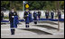 Soldiers hold ceremonial clothes that were draped over the 184 memorial benches, each honoring all innocent life lost when American Airlines Flight 77 crashed into the Pentagon on Sept. 11, 2001, during the dedication of the 9/11 Pentagon Memorial Thursday, Sept. 11, 2008, in Arlington, VA.