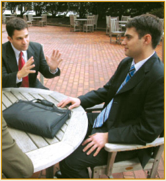 photo of 2 men in discussion