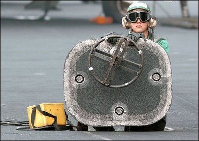 The Arabian Gulf (Mar. 23, 2003) -- An Aviation Boatswain's Mate stands ready to engage the jet-blast deflector (JBD) during flight operations aboard USS Abraham Lincoln (CVN 72). U.S. Navy photo by Photographer's Mate 3rd Class Philip A McDaniel