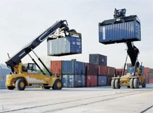 Reach stackers moving container cargo.