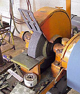 Bench grinder with proper guard and correctly adjusted work rest