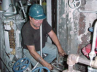 Boilermaker working on boiler piping system