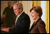 President George W. Bush is joined by Mrs. Laura Bush in the East Room of the White House, Friday, Nov. 16, 2007, in an address to invited guests in celebration of National Adoption Day. President Bush, in speaking to parents and children, said he was "So thankful that the parents and children here today have found the gift of one another. And I encourage our citizens across the land to explore adoption, look into the joys of adoption, and provide love for somebody who needs it."